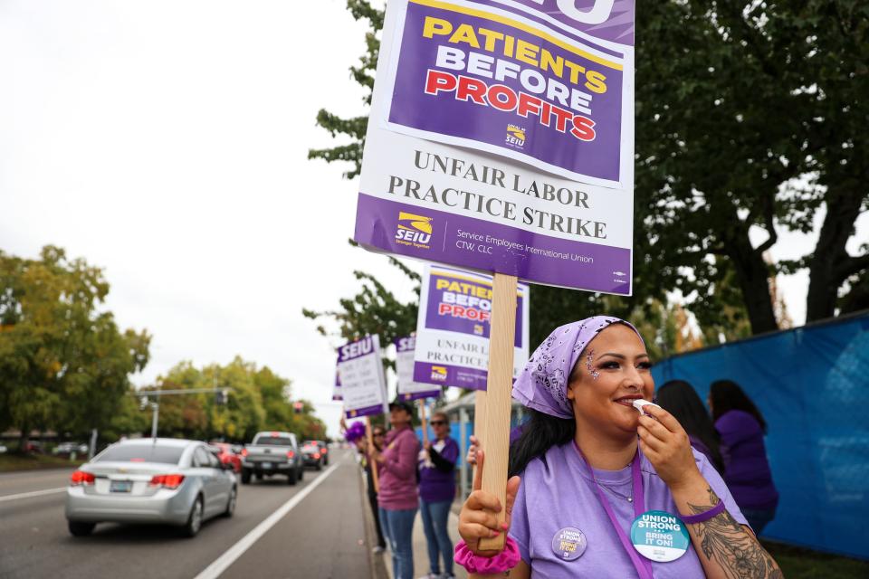 Phlebotomist Cassidy Atkinson strikes with fellow Kaiser Permanente employees in protest of understaffing and unfair labor practices on Wednesday, Oct. 4, 2023 in Salem, Ore.