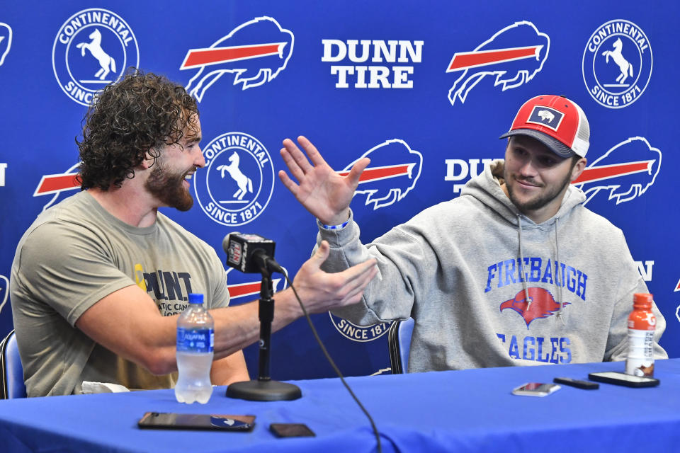 Buffalo Bills tight end Dawson Knox, left, and quarterback Josh Allen celebrate during a news conference after an NFL football game against the Houston Texans, Sunday, Oct. 3, 2021, in Orchard Park, N.Y. (AP Photo/Adrian Kraus)