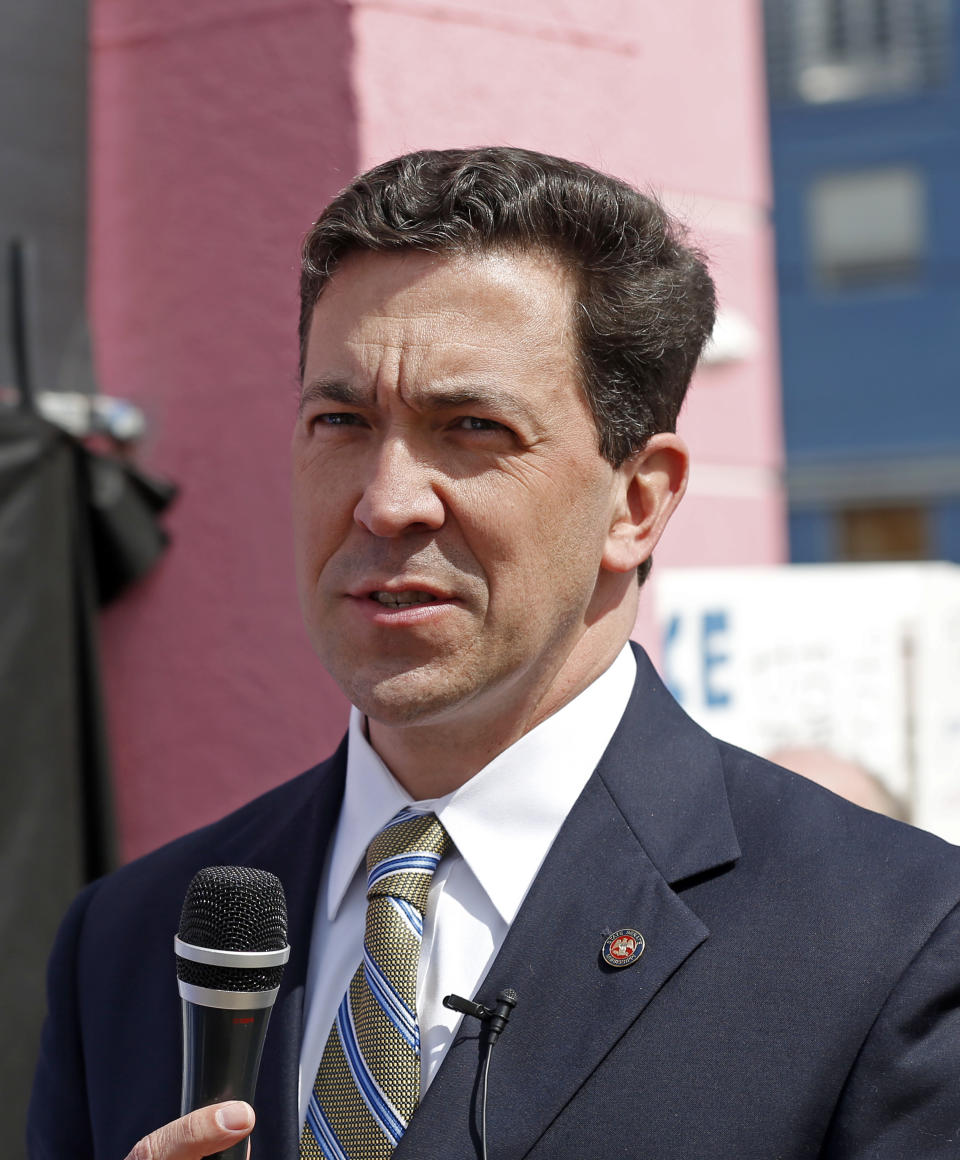 This photo taken March 5, 2014 shows Mississippi State Sen. Chris McDaniel, R-Ellisville, speaking to fellow abortion opponents outside the Jackson Women's Health Organization clinic in Jackson, Miss., and the only medical facility still performing abortions in the state. Thad Cochran is engaged in his toughest campaign in a generation. The former Appropriations Committee chairman faces a June 3 primary challenge from a two-term state lawmaker. Chris McDaniel riles up tea party voters by denouncing big federal spending and portraying the 76-year-old incumbent as a Washington insider who’s lost touch with folks back home. (AP Photo/Rogelio V. Solis)