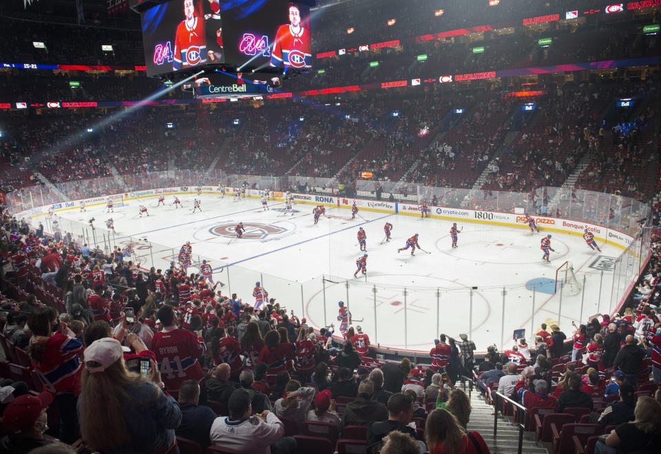 The Montreal Canadiens take to the ice to warm up for the NHL hockey team's home-opener against the New York Rangers on Saturday, Oct. 16, 2021, in Montreal. (Graham Hughes/The Canadian Press via AP)