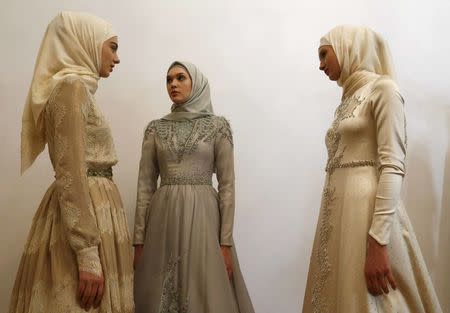 Models gather before a show of the Firdaws fashion house led by Aishat Kadyrova, daughter of the Chechen Republic head Ramzan Kadyrov, at the Mercedes-Benz Fashion Week Russia in Moscow, Russia, March 17, 2017. REUTERS/Sergei Karpukhin