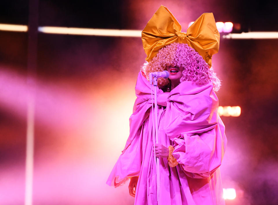 A closeup of Sia performing