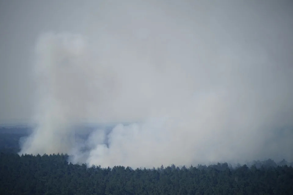 Uncontrolled fire in a Berlin forest after detonation in an explosives warehouse