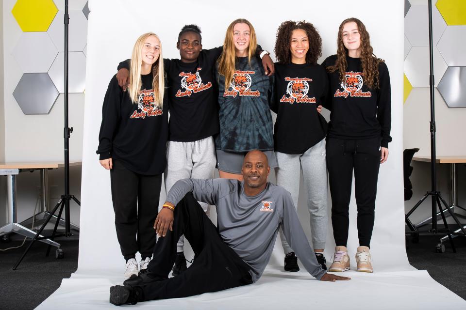 (From left) Northeastern basketball players Paige Reichard, Nylah Davis, Colleen Finnegan, Mikayla Coleman and Lauralye Kennedy pose for a photo with head coach Maurice Coleman during YAIAA winter sports media days Thursday, November 9, 2023, in York.