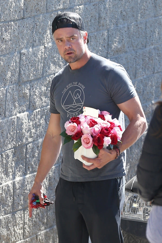 <p>The <em>Transformers</em> star looked to comfort his estranged wife Fergie by bringing her flowers on Monday, after her performance of the national anthem at the NBA All-Star Game, which was met with less-than-stellar reviews. (Photo: Wago/BackGrid)<br><br></p>