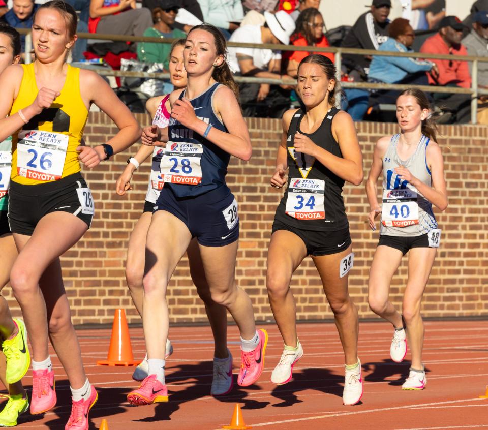 Tatnall's Carlita Kaliher (second from right) competes in the high school girls 3,000 championship at Penn Relays Friday, April 26. Kaliher placed 10th.