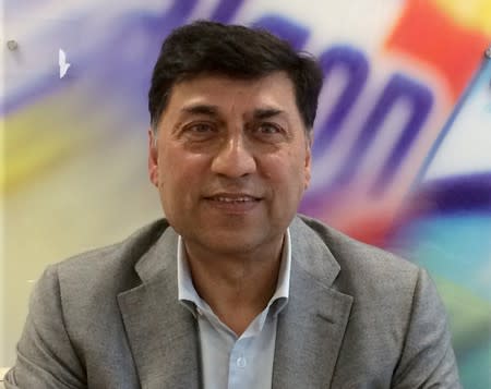 FILE PHOTO: Rakesh Kapoor, the CEO of Reckitt Benckiser, poses for a photograph at the company headquarters in Slough