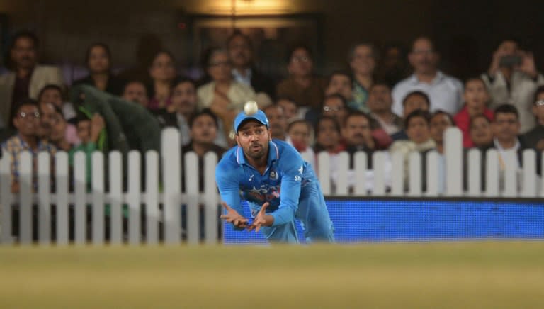 India's Rohit Sharma attempts a catch during the second T20 international match between India and Sri Lanka at the Jharkhand State Cricket Association International Stadium Complex in Ranchi, on February 12, 2016