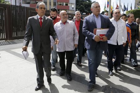 Pedro Carreno (front, 3rd L), deputy of Venezuela's United Socialist Party (PSUV), arrives at the Supreme Court to challenge the swearing-in of three opposition deputies, next to fellow deputies in Caracas, January 7, 2016. REUTERS/Marco Bello