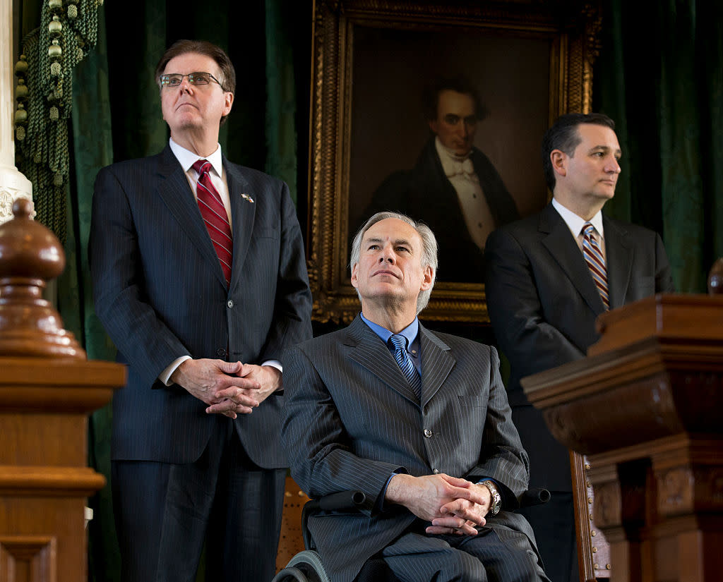 Texas' incoming Lt. Gov. Dan Patrick (left) and Gov. Greg Abbott listen, alongside Sen. Ted Cruz, during transition ceremonies at the Texas Capitol in January 2015. (Photo: Robert Daemmrich Photography Inc./Corbis/Getty Images)