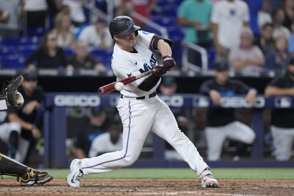 Miami Marlins' Nick Fortes hits a single to bring in the game-winning run during the ninth inning of a baseball game against the San Diego Padres, Wednesday, May 31, 2023, in Miami. (AP Photo/Wilfredo Lee)