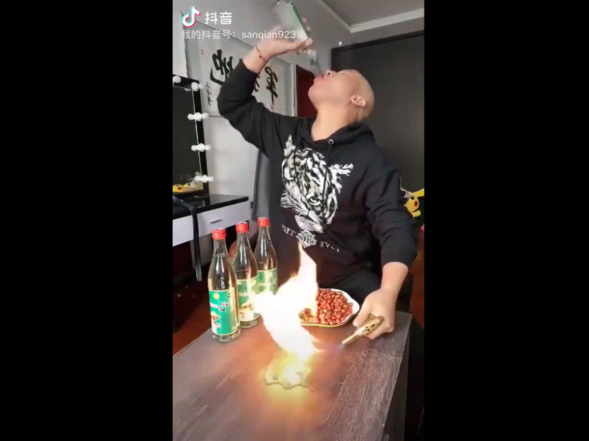 Chinese Douyin user drinking alcohol during livestream  (Screengrab/@Byron_Wan)