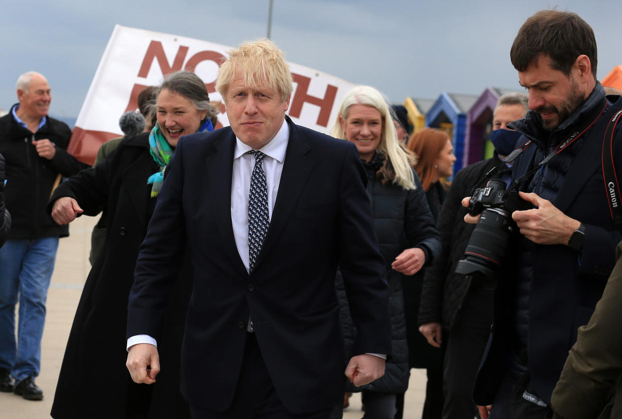 Prime Minister Boris Johnson (centre) reacts as he campaigns on behalf of Conservative Party candidate Jill Mortimer (second left) in Hartlepool, in the north-east of England ahead of the 2021 Hartlepool by-election to be held on May 6. Picture date: Monday May 3, 2021.