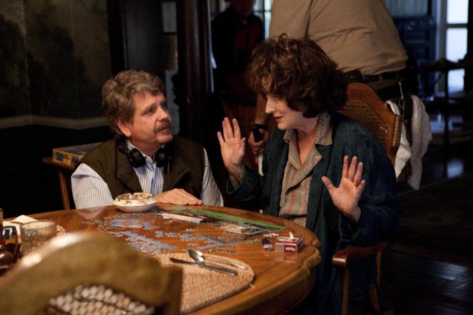 This image released by The Weinstein Company shows director John Wells, left, and actress Meryl Streep during the filming of "August: Osage County." Streep was nominated for a Golden Globe for best actress in a motion picture musical or comedy for her role in the film. (AP Photo/The Weinstein Company, Claire Folger)