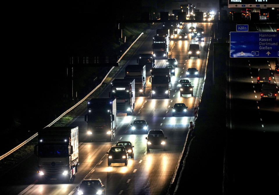 Trucks and cars roll on a highway in Frankfurt, Germany, Tuesday, Oct. 26, 2021. (AP Photo/Michael Probst)