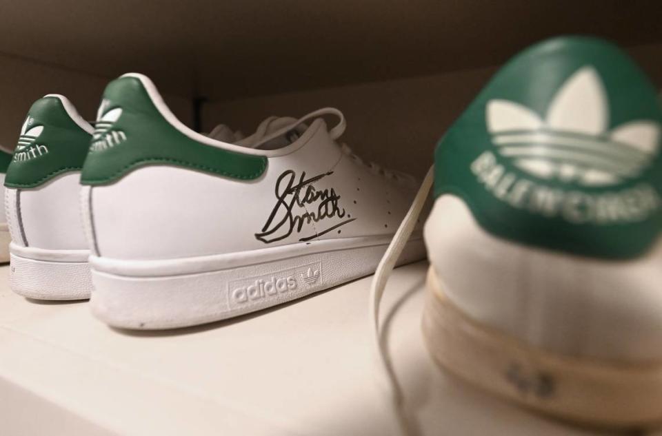 A pair of autographed Adidas Stan Smith tennis shoes sit on a shelf in the former professional tennis player’s closet on Monday, March 24, 2024. Adidas renamed the shoe after Smith in 1978. Smith won the 1971 US Open and the 1972 Wimbledon Championships. He was ranked No. 1 in the world in 1972.