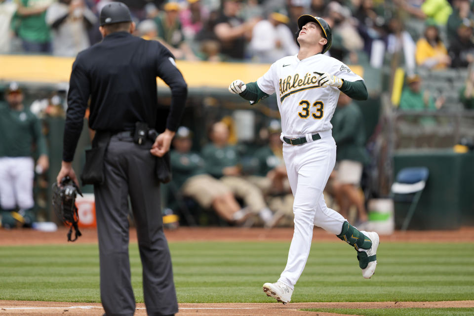 Oakland Athletics' JJ Bleday (33) looks up as he crosses home plate after hitting a home run during the second inning against the Seattle Mariners in a baseball game in Oakland, Calif., Thursday, May 4, 2023. (AP Photo/Tony Avelar)