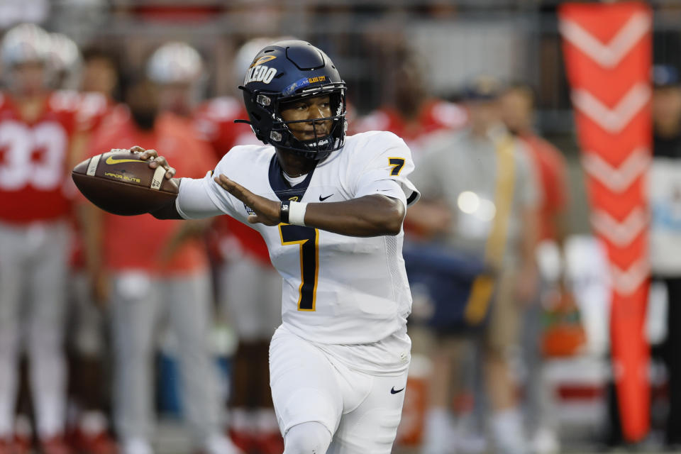 Toledo quarterback Dequan Finn throws a pass against Ohio State during the first half of an NCAA college football game Saturday, Sept. 17, 2022, in Columbus, Ohio. (AP Photo/Jay LaPrete)