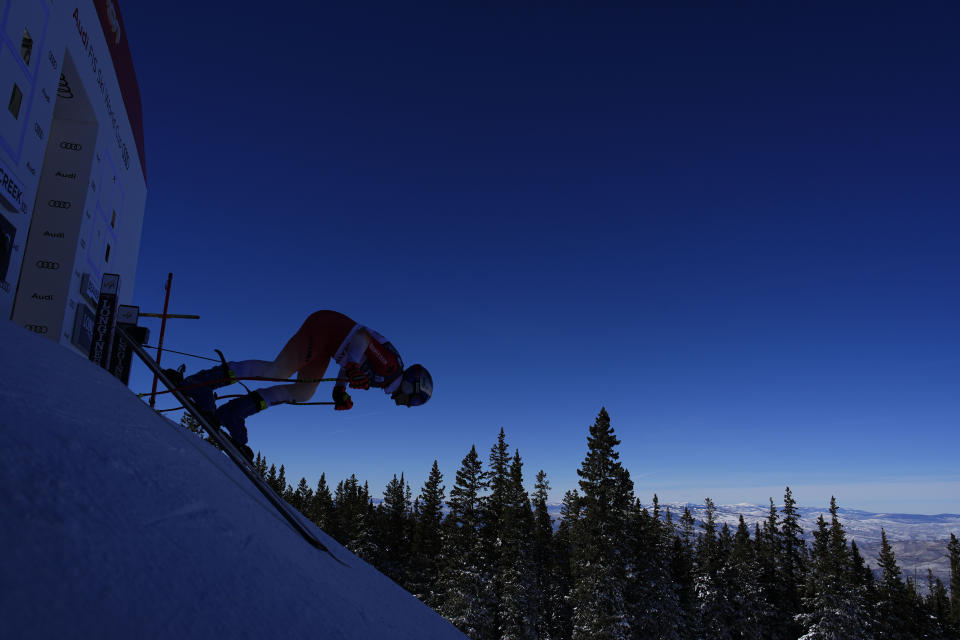 Switzerland's Marco Odermatt jumps off the starting gate during a men's World Cup downhill training run Wednesday, Nov. 30, 2022, in Beaver Creek, Colo. (AP Photo/John Locher)