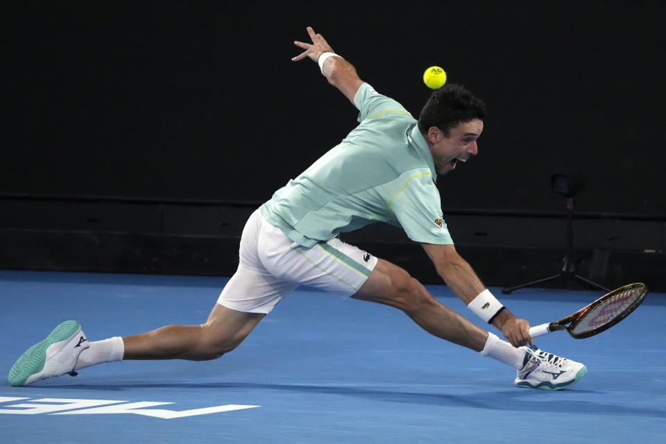 Roberto Bautista Agut of Spain plays a backhand return to Andy Murray of Britain during their third round match at the Australian Open tennis championship in Melbourne, Australia, Saturday, Jan. 21, 2023. (AP Photo/Ng Han Guan)