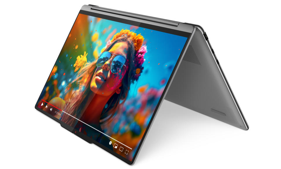 Product marketing photo of the Lenovo 9i 2-in-1 laptop. View from slightly above and to the right. The device is folded so that it’s sitting up like a tent with its display visible on the outside.