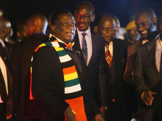 Zimbabwean president Emmerson Mnangagwa arrives at Robert Mugabe International airport in Harare on Monday night (AP)