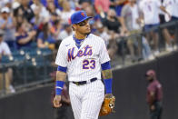 New York Mets' Javier Baez looks up into the stands as he enters the field for the first time as a Met in the first inning of the baseball game against the Cincinnati Reds, Saturday, July 31, 2021, in New York. (AP Photo/Mary Altaffer)