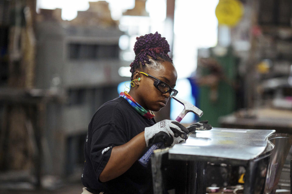 Sheet metal worker Carey Mercer assembles ductwork at Contractors Sheet Metal on Tuesday, Aug. 3, 2021, in New York. The construction industry is fighting to recruit more women into a sector that faces chronic labor shortages. Women make up only 4% of skilled construction laborers in the U.S. and often face discrimination on jobs sites. (AP Photo/Kevin Hagen)