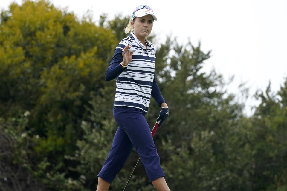 Lexi Thompson acknowledges the crowd after making her putt on the first green during the first round of the U.S. Women's Open golf tournament at The Olympic Club, Thursday, June 3, 2021, in San Francisco. (AP Photo/Jeff Chiu)