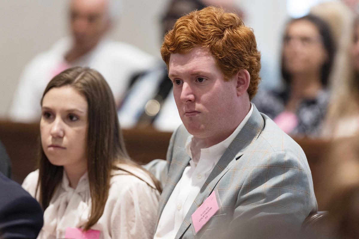 Buster Murdaugh holds his head in hands as his father sobs about