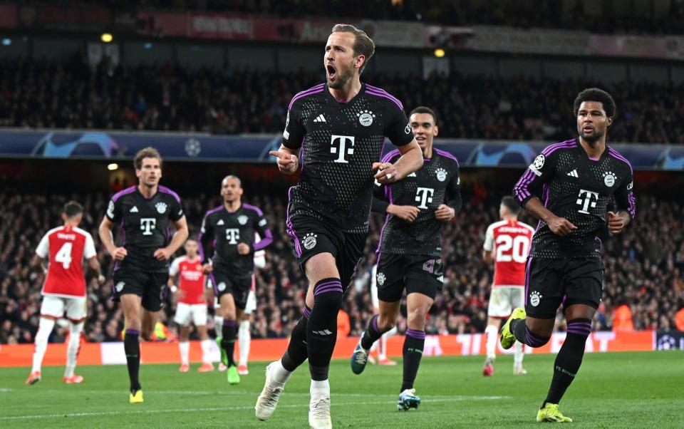 Harry Kane celebrates scoring a penalty for Bayern Munich against Arsenal