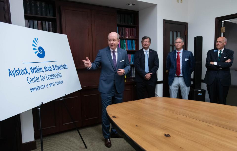 Director Timothy Kinsella, left, talks Tuesday about the University of West Florida's partnership with the Aylstock, Witkin, Kreis & Overholtz law firm, which donated $2.5 million to the school.