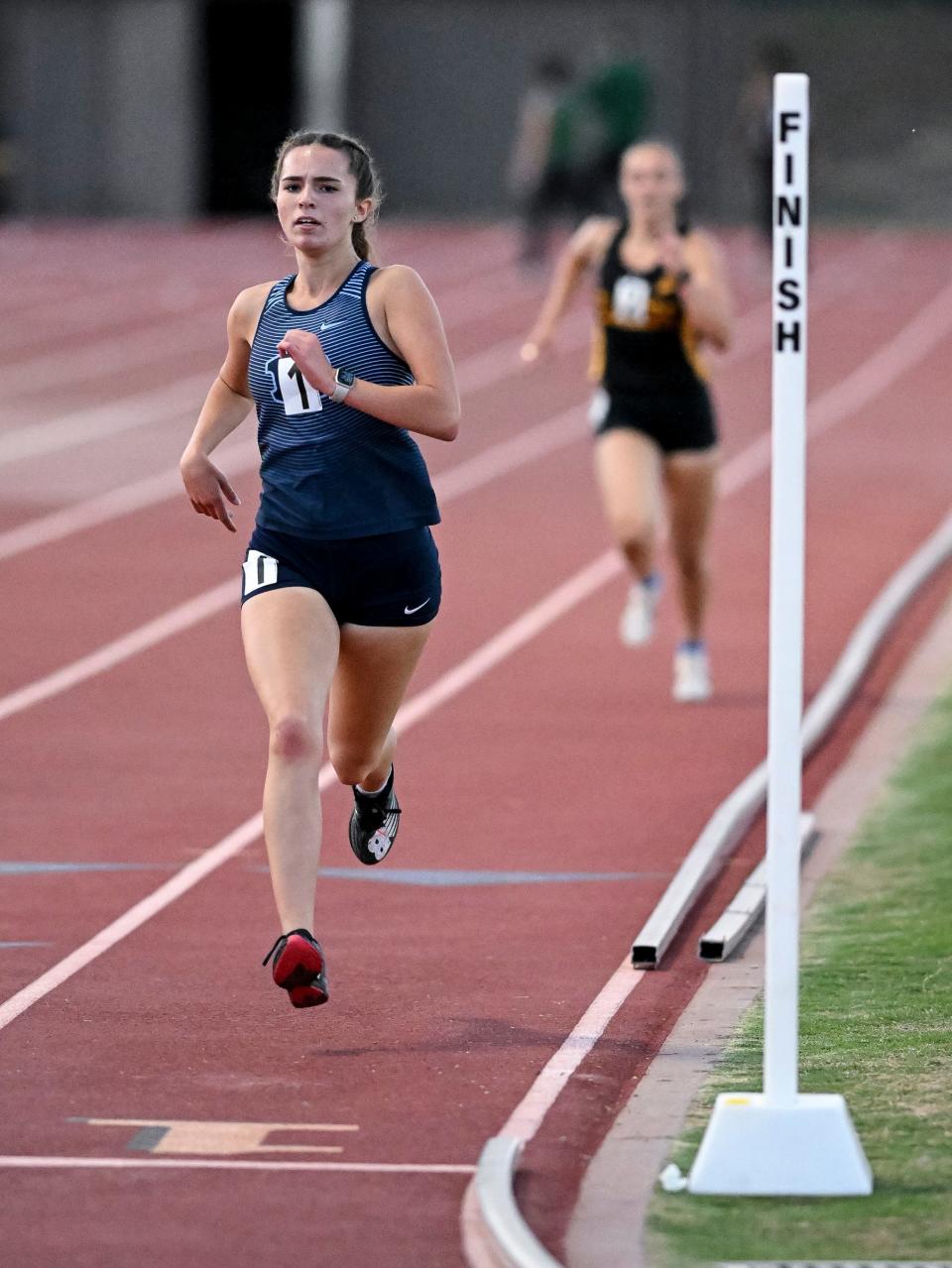 Redwood's Zoe Matlock, near, and Golden West's Cadence Estermann finish first and second in the girls 3200m run during the 2022 West Yosemite League high school track and field championships at Golden West on Wednesday, May 4, 2022. 