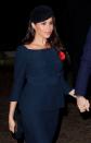 <p>The royal wore a navy peacoat dress with bateau neckline - similar to her <a href="https://www.net-a-porter.com/gb/en/Shop/Designers/Givenchy?pn=1&npp=60&image_view=product&dScroll=0" rel="nofollow noopener" target="_blank" data-ylk="slk:Givenchy;elm:context_link;itc:0;sec:content-canvas" class="link ">Givenchy</a> wedding dress silhouette - accessorised with a velvet fascinator. </p><p>The ensemble was reminiscent of the pink <a href="https://www.net-a-porter.com/gb/en/Shop/Designers/Prada?pn=1&npp=60&image_view=product&dScroll=0" rel="nofollow noopener" target="_blank" data-ylk="slk:Prada;elm:context_link;itc:0;sec:content-canvas" class="link ">Prada</a> look she wore back in June 2018 when she attended the Queen's Young Leaders Awards.</p>