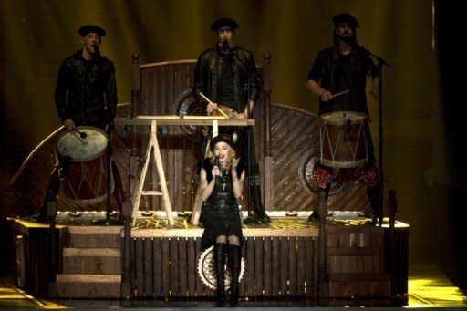 US pop icon Madonna performs on stage during her first MDNA world tour concert in the Ramat Gan Stadium, near Tel Aviv in May 2012. Madonna hit the stage running at Abu Dhabi's Yas Island stadium on Sunday in her first ever concert in the Gulf, days after launching the world tour in Israel