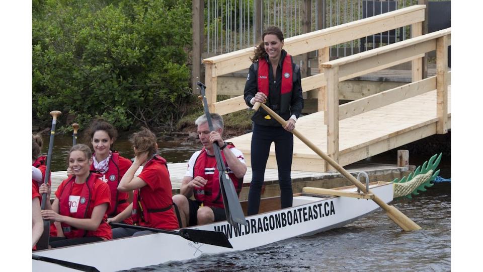 The Duchess Of Cambridge rows in a Dragon Boat in Canada against Prince William