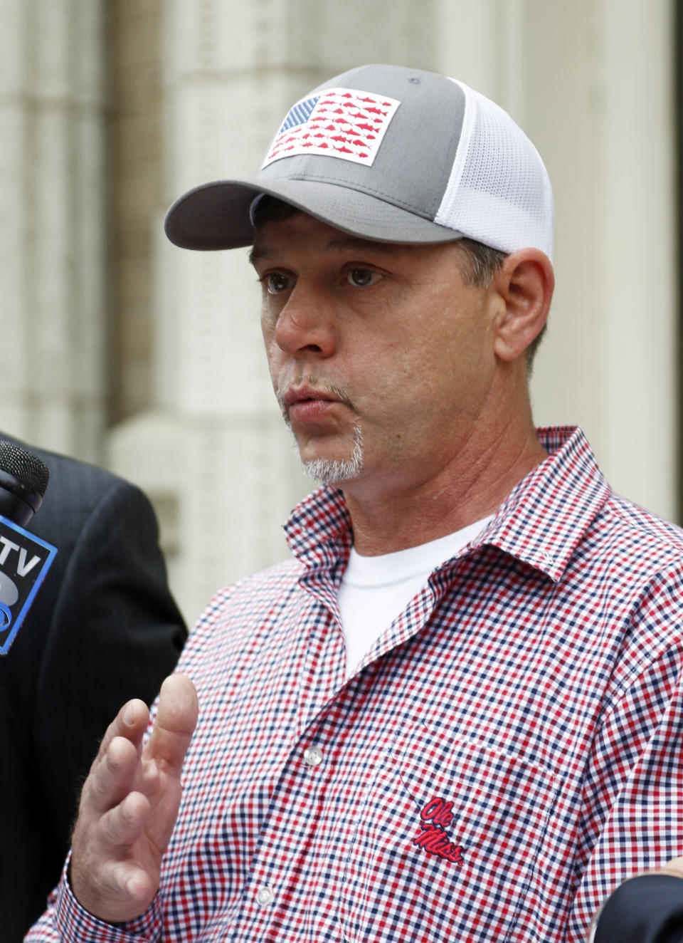 FILE - In this March 27, 2018, file photo, former convict Dennis Hopkins speaks at a news conference in Jackson, Miss. A federal appeals court will hear arguments Tuesday, Dec. 3, 2019, on whether Mississippi laws that restrict the voting rights of certain felons are unconstitutional. Former convicted felons affected by the state's laws are pushing to have their voting rights restored. (AP Photo/Rogelio V. Solis, File)