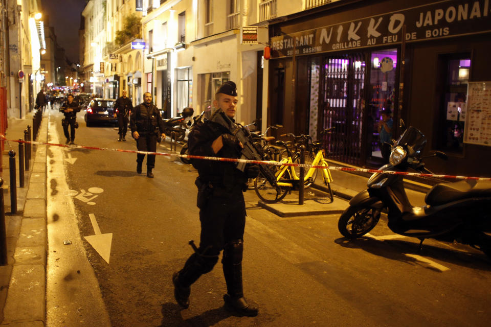 <p>A police officer cordons off the area after a knife attack in central Paris, Saturday May 12, 2018. (Photo: Thibault Camus/AP) </p>