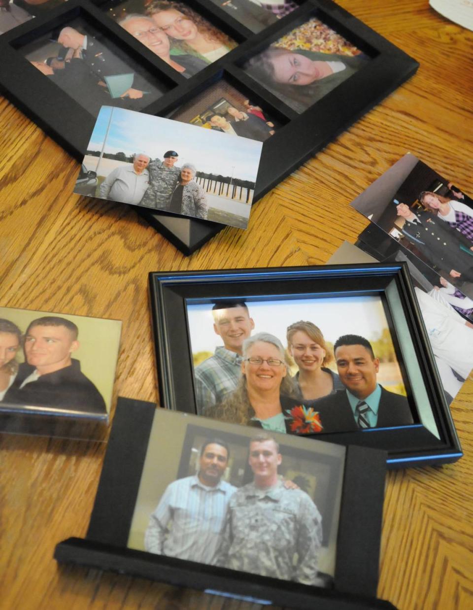 Photographs of U.S. Army Spc. Patrick Lay, who died while serving in Afghanistan, are displayed on the table in his family’s Bradenton home.