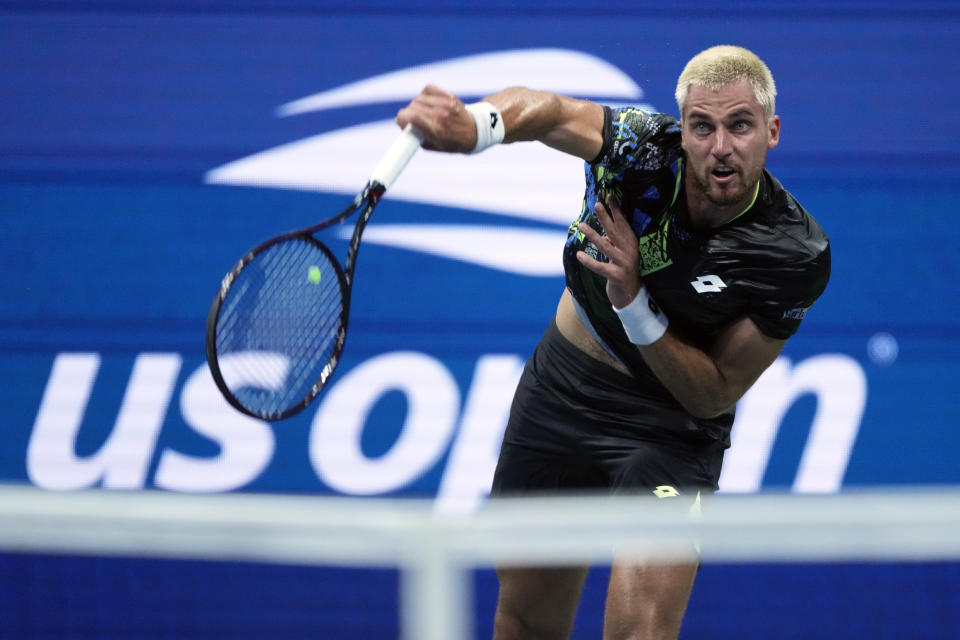 Borna Gojo, of Croatia, serves to Novak Djokovic, of Serbia, during the fourth round of the U.S. Open tennis championships, Sunday, Sept. 3, 2023, in New York. (AP Photo/John Minchillo)