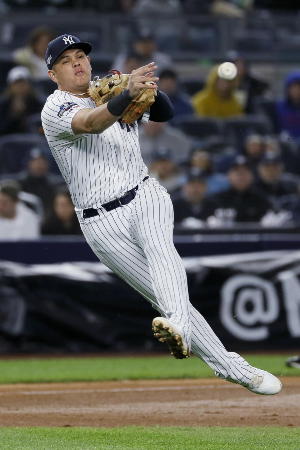 FILE - In this Oct. 18, 2019, file photo, New York Yankees third baseman Gio Urshela throws out Houston Astros' Yuli Gurriel at first during the eighth inning in Game 5 of baseball's American League Championship Series in New York. New York's position players include catcher Gary Sánchez, first baseman Luke Voit, second baseman DJ LeMahieu, shortstop Gleyber Torres and third baseman Urshela. (AP Photo/Matt Slocum, File)