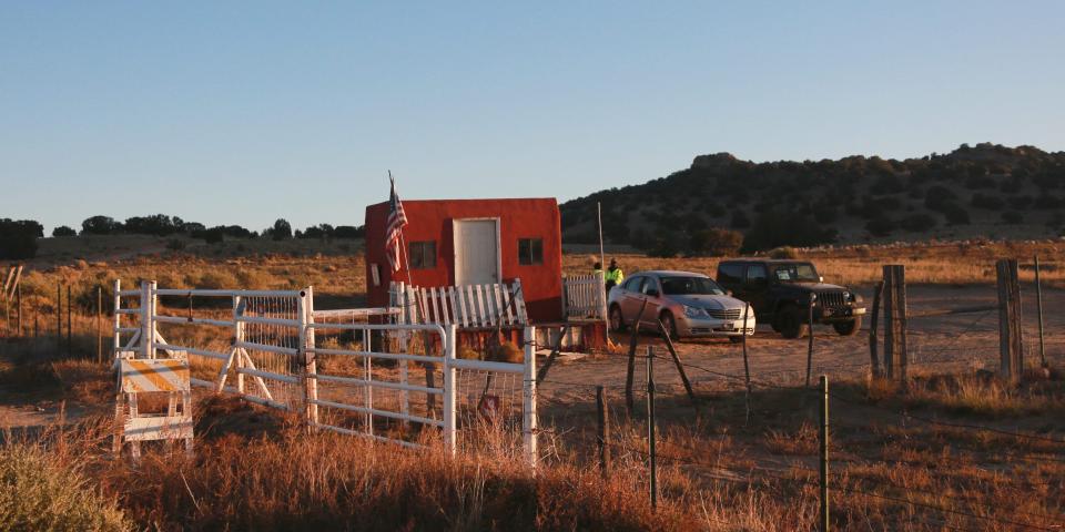 The entrance to a film set where police say actor Alec Baldwin fired a prop gun, killing a cinematographer, is seen outside Santa Fe, New Mexico, Friday, Oct. 22, 2021.