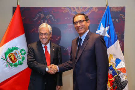 Peru's President Martin Vizcarra (R) and his Chilean counterpart Sebastian Pinera attend a bilateral meeting prior to the Summit of the Americas in Lima, Peru April April 13, 2018. Presidential Palace Handout via REUTERS