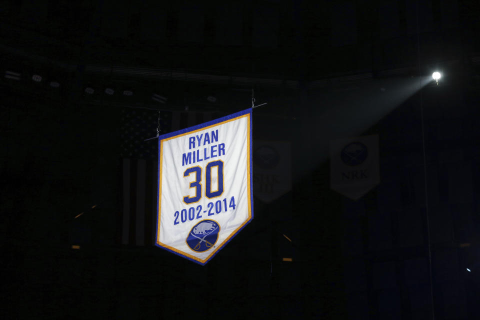 A banner with former Buffalo Sabres goaltender Ryan Miller's name and number is raised to the rafters before an NHL hockey game between the Sabres and the New York Islanders on Thursday, Jan. 19, 2023, in Buffalo, N.Y. (AP Photo/Joshua Bessex)