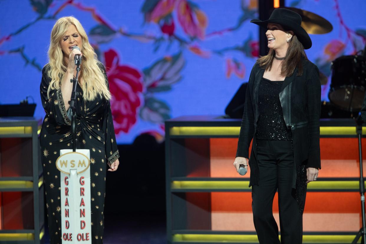 Trisha Yearwood and Terri Clark, onstage Wednesday at the Grand Ole Opry.