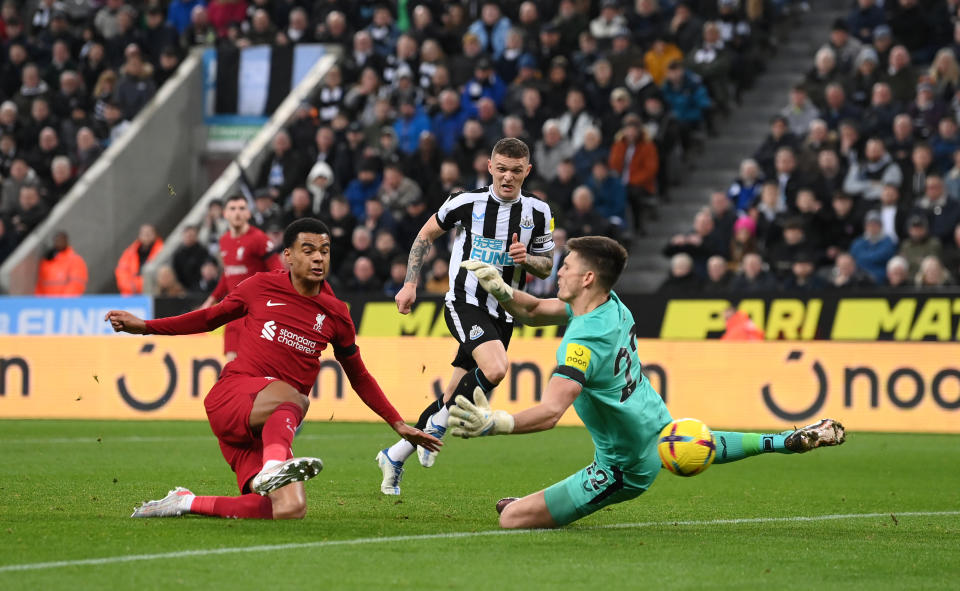 NEWCASTLE UPON TYNE, ENGLAND - FEBRUARY 18: Cody Gakpo of Liverpool scores the team's second goal past Nick Pope of Newcastle United during the Premier League match between Newcastle United and Liverpool FC at St. James Park on February 18, 2023 in Newcastle upon Tyne, England. (Photo by Stu Forster/Getty Images)