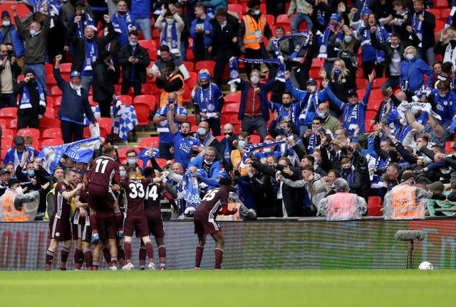 Leicester players and fans celebrate Youri Tielemans' strike