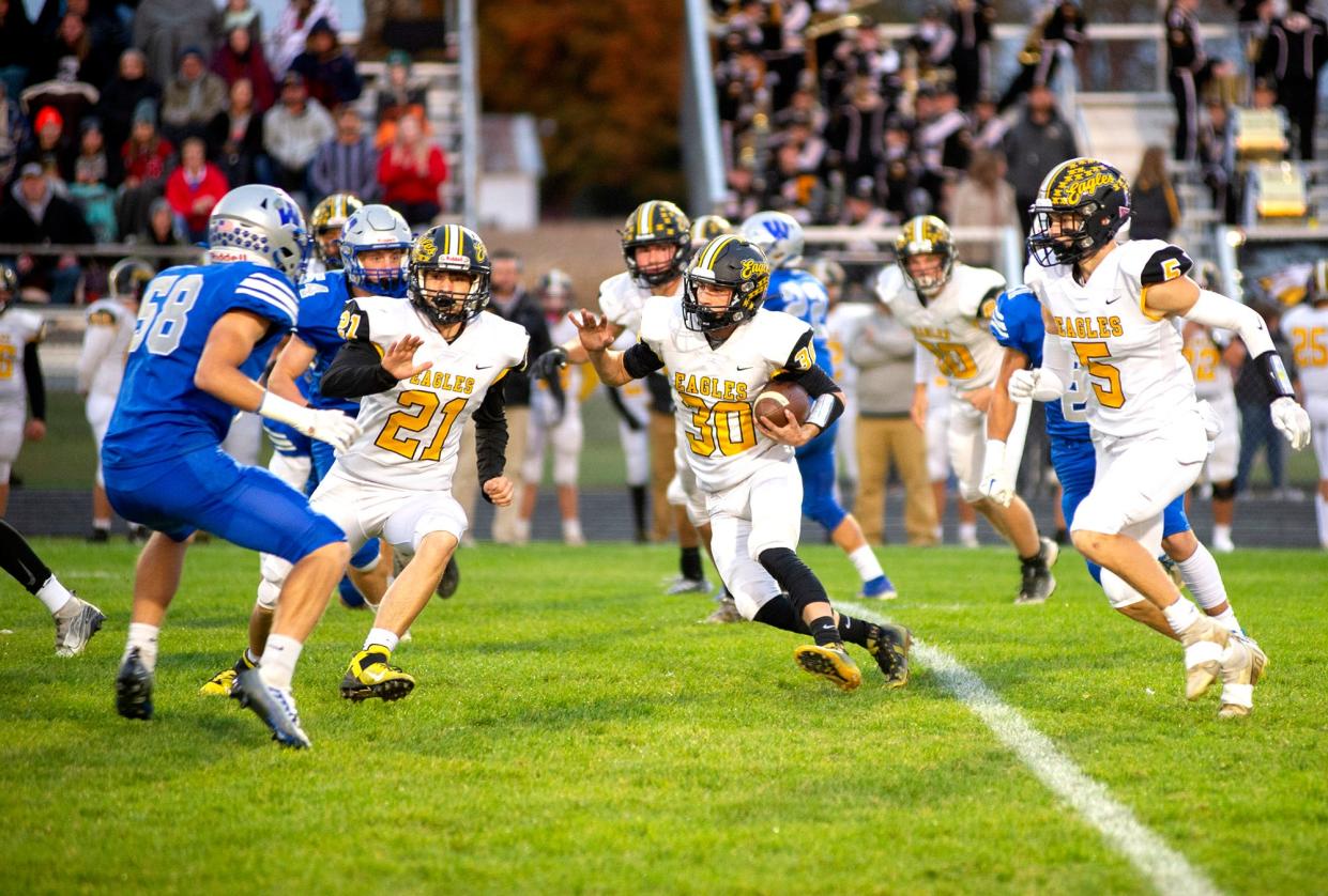 Colonel Crawford's Tanner Dyer returns the opening kickoff for a gain.