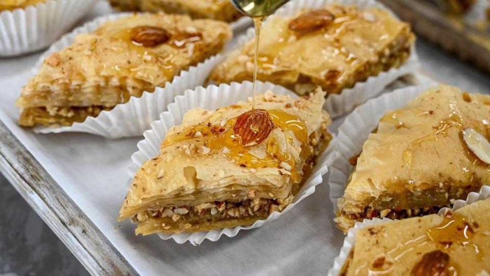 A sweet syrup drizzle is added to almond baklava at Baklava House now open on Bullard Avenue near West in Fresno.