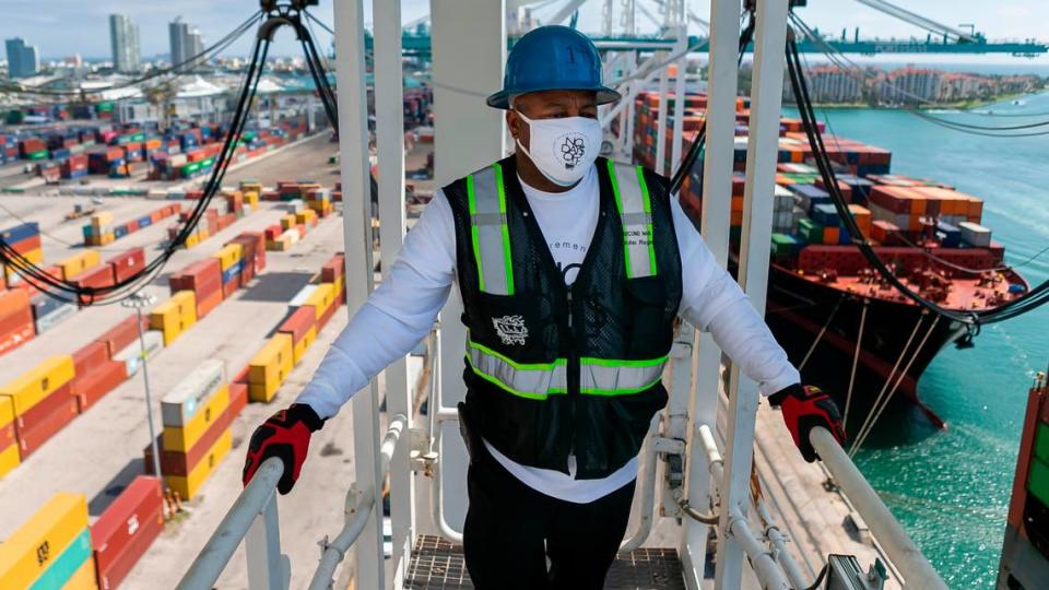 John Ragin, 56, works to offload containers from a cargo ship at PortMiami on Saturday, February 20, 2021. Ragin, a header, has been working as a longshoreman for 27 years.